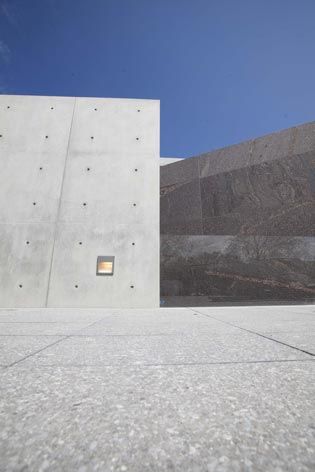Visitor center concrete and red granite walls