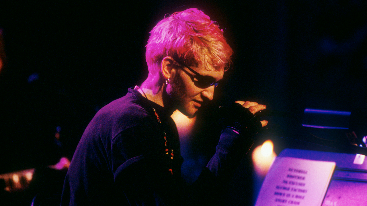 Layne in sunglasses looking down on stage