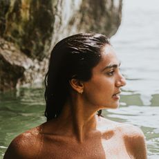 scalp sunscreens - woman with wet hair in the sea