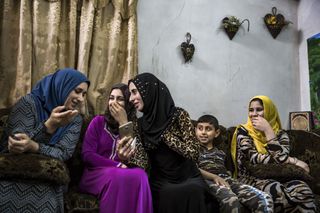 Iraq women chatting at home