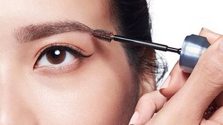 Woman Applying Benefit 3D Browtones to Eyebrows