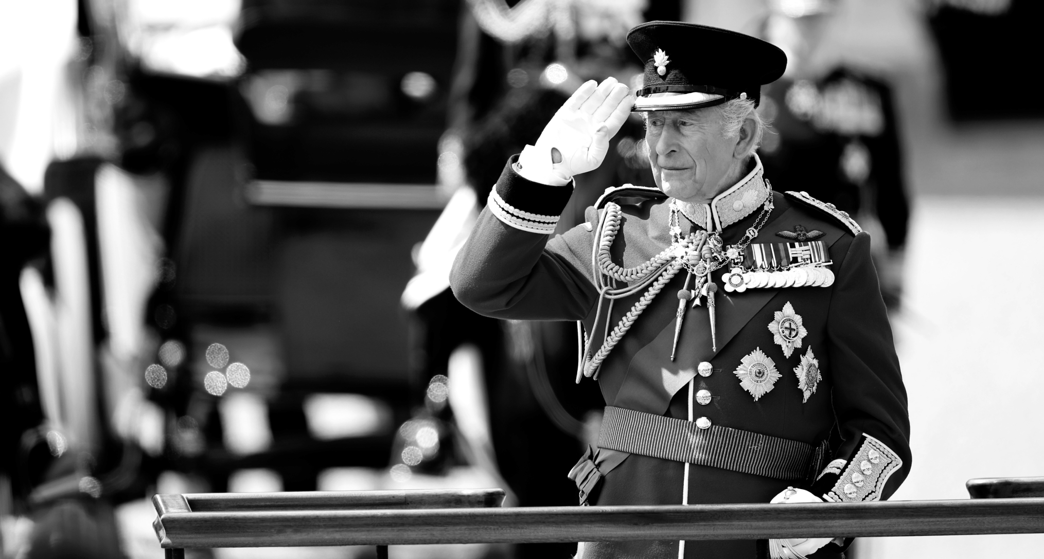 King Charles saluting in a military uniform