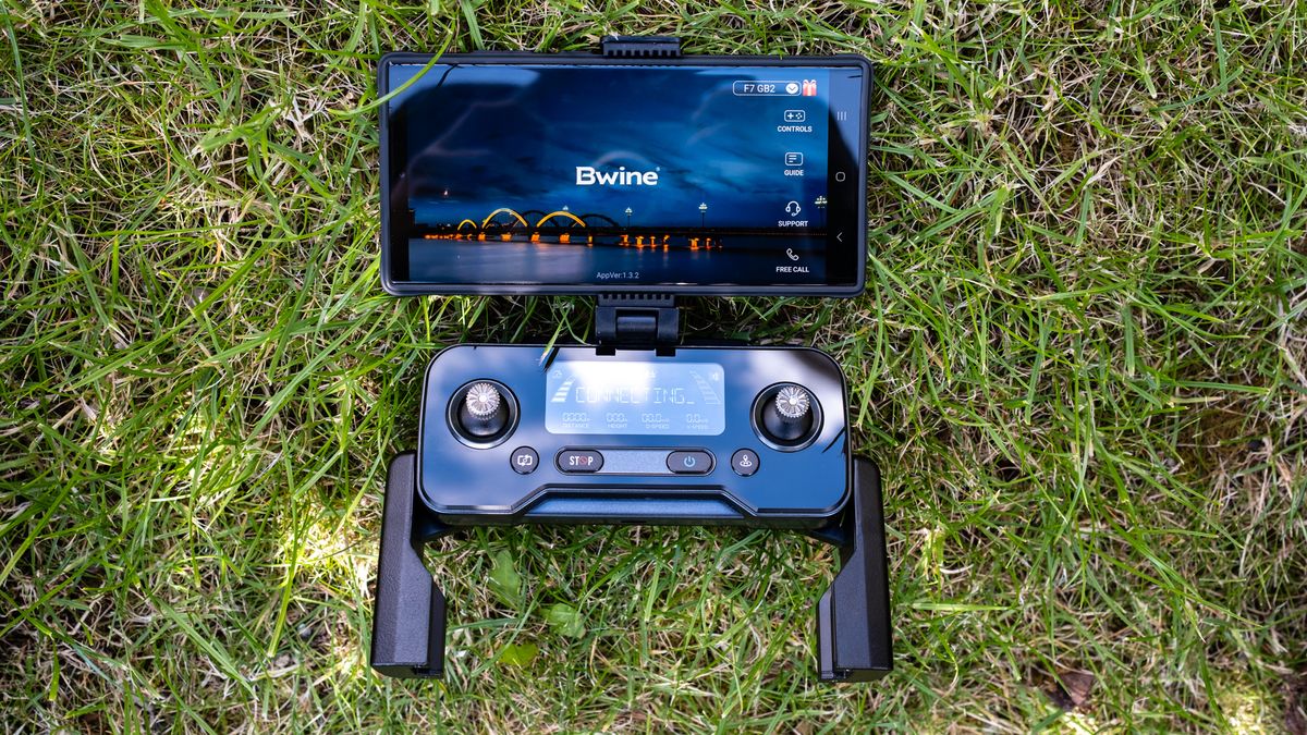 Bwine F7GB2 drone controller and smartphone running the Bwine Drone app