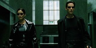 Carrie-Ann Moss as Trinity as Keanu Reeves as Neo in The Matrix (1999)