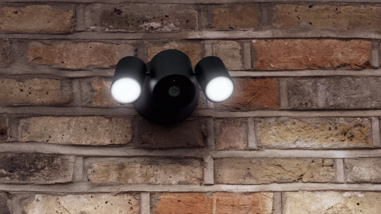 Apple Home Colllection's LG Floodlight Cam on brick wall