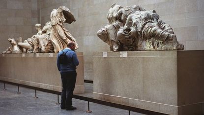 A visitor to the British Museum in London looks at some of the Elgin Marbles