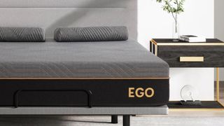 The EGOHOME Black 12" Hybrid Mattress on a low-profile bed frame in a modern mattress.