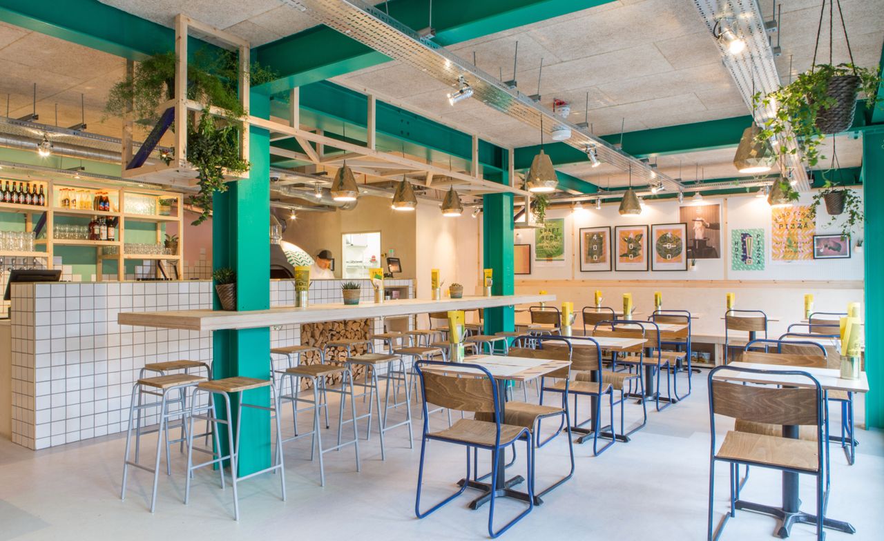 Wide shot of restaurant with green accents