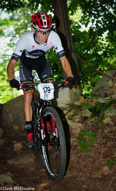 Neilson Powless (Whole Athlete) descending through the trees