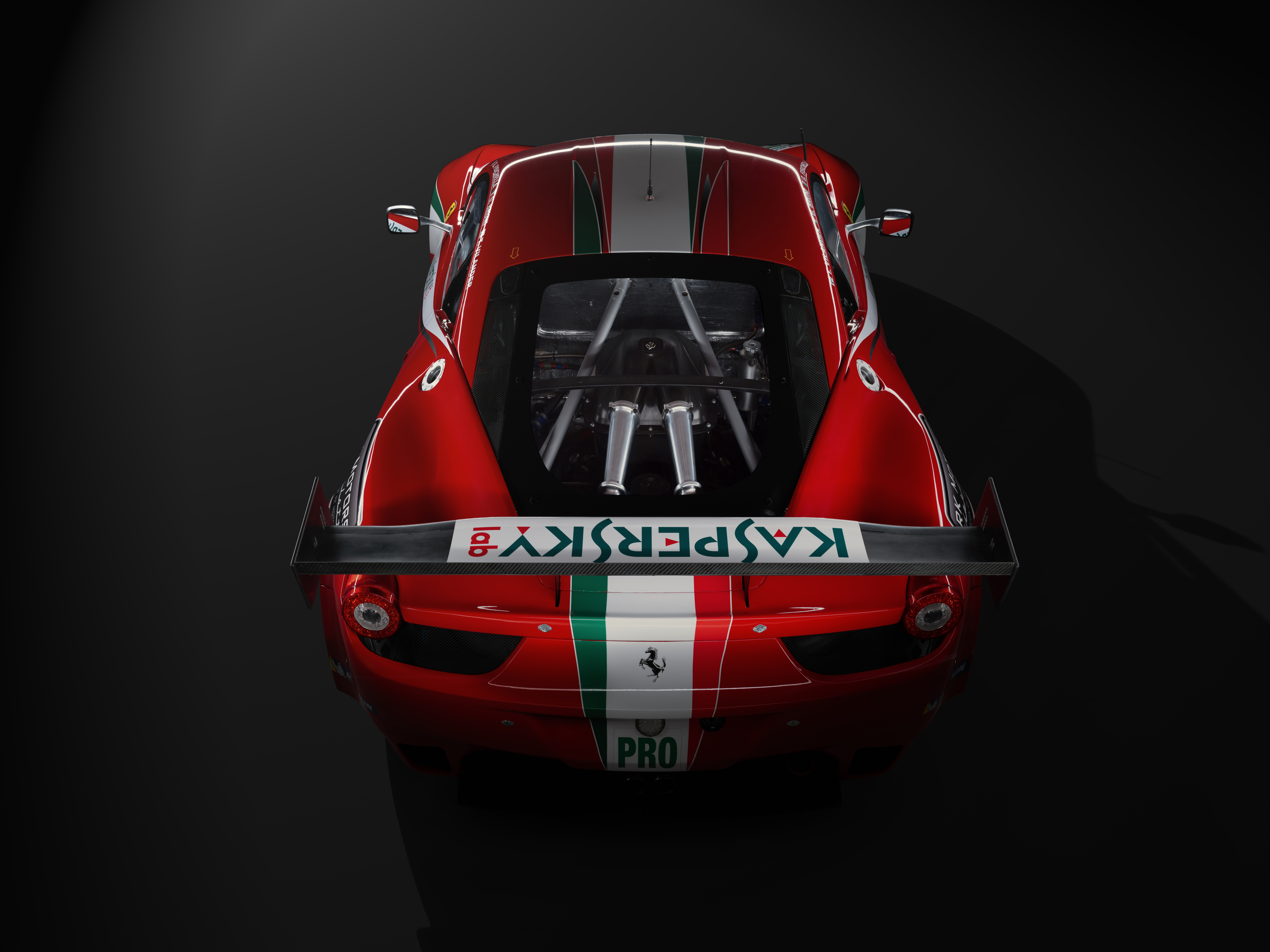 A red Ferrari 458 car in a studio