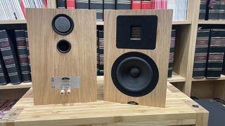Neat Petite Classic speakers on a rack
