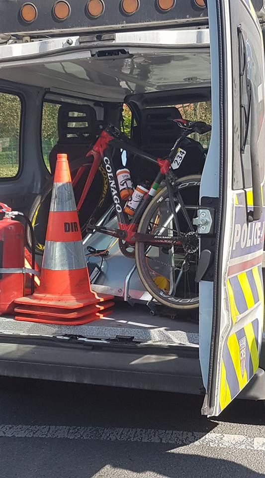 Andrea Guardini's bike packed into the back of a police van.