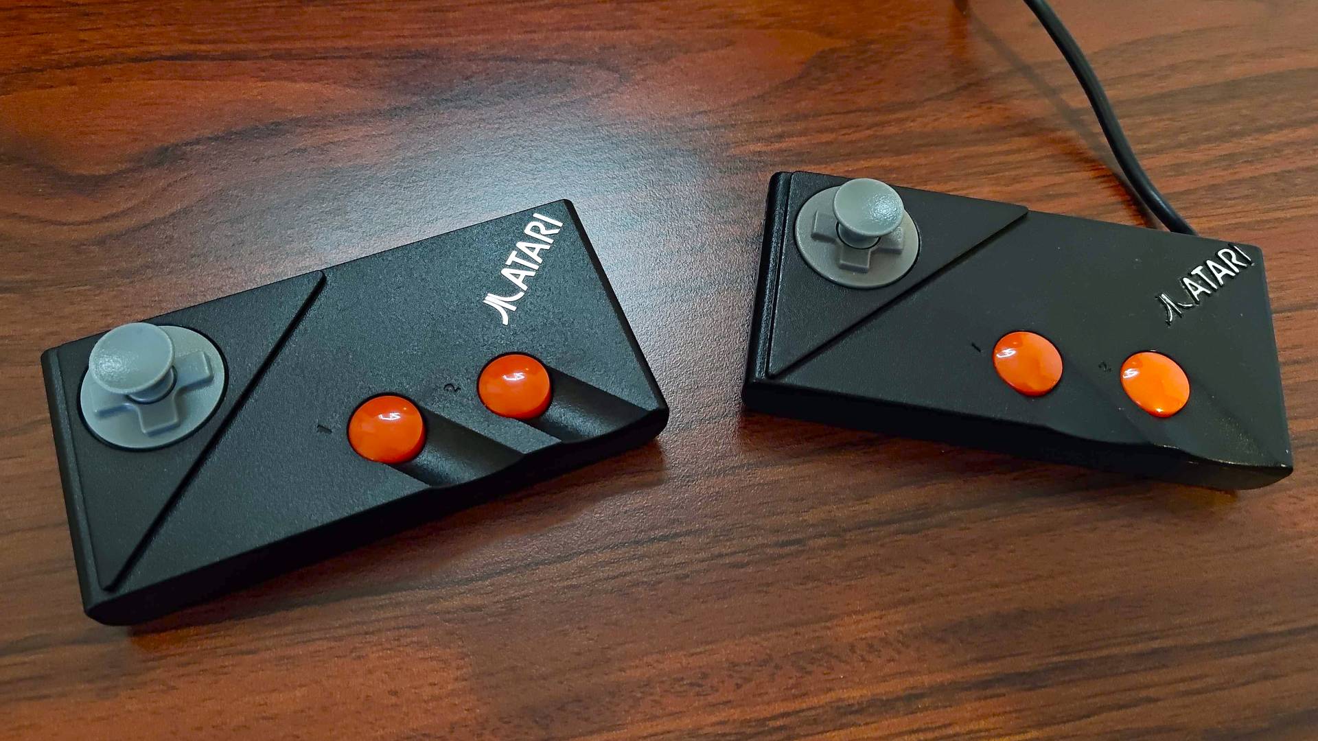 Atari 7800+ controller next to original on desk