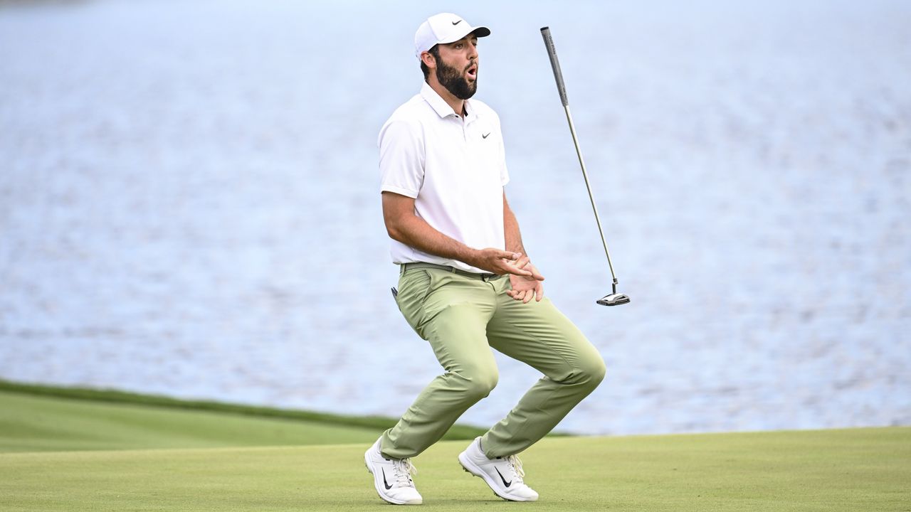 Scottie Scheffler throws his putter in the air in reaction to a missed putt on the 72nd hole at last year&#039;s The Players Championship