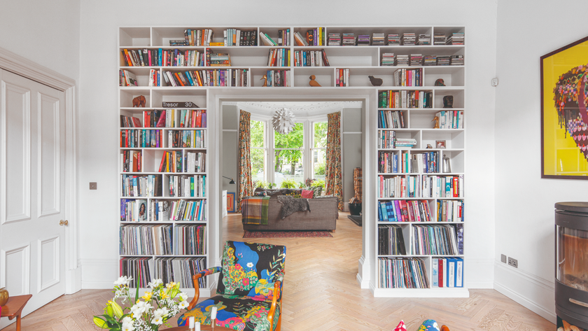 Built in storage idea where a bookcase wraps around a door frame