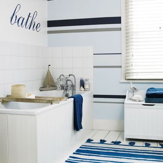bathroom with white bathtub and split window