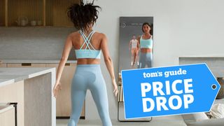 Woman using the Mirror home gym to workout
