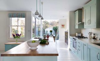 Period home kitchen extensions: Roundhouse kitchen extension with corner glazing