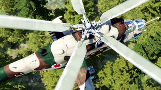 Best flight sims — an overhead screenshot of an attack helicopter in DCS World as it flies over woodland.