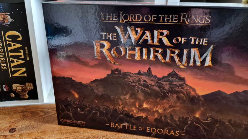 War of the Rohirrim - Battle of Edoras box on a table, in front of shelves with board games