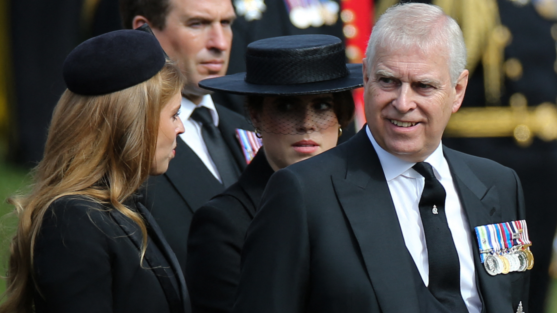 Prince Andrew smiling at Princess Beatrice, with Princess Eugenie in a black veiled hat behind them