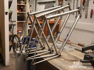 A trio of freshly welded steel frames waiting for their braze-ons and bridges
