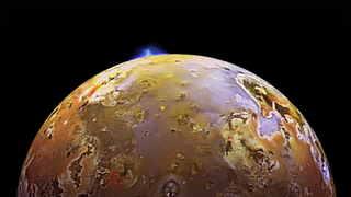 Io’s surface is peppered with volcanoes and lava lakes. Here, NASA’s Galileo spacecraft captured an image of Io in the midst of a volcanic eruption.