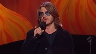Mitch Hedberg talking into a mic.