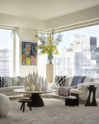 minimalist living room with NYC skyline views