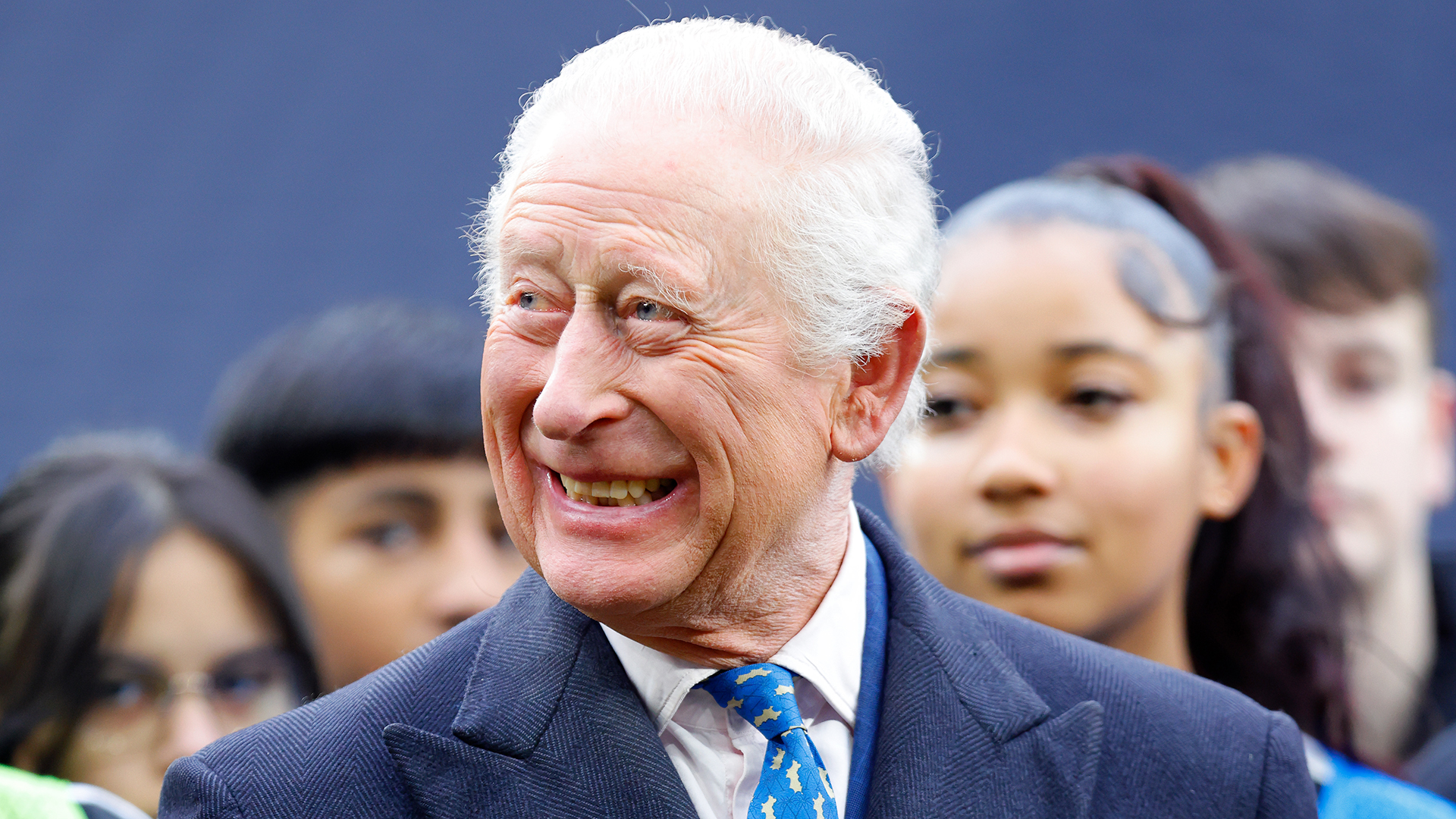 LONDON, UNITED KINGDOM - FEBRUARY 12: (EMBARGOED FOR PUBLICATION IN UK NEWSPAPERS UNTIL 24 HOURS AFTER CREATE DATE AND TIME) King Charles III attends a demonstration by young people involved in The Huddle Project during a visit to Tottenham Hotspur Stadium on February 12, 2025 in London, England. The Huddle Project is a dual sport programme (launched in 2023 by Tottenham Hotspur Football Club, the National Football League (NFL) and Nike) for boys and girls aged 11-18 which increases access to free football and NFL Flag. (Photo by Max Mumby/Indigo/Getty Images)