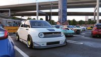 Forza Horizon 6: A white Honda with gold rims parked next to various other cars at a meet under a highway.