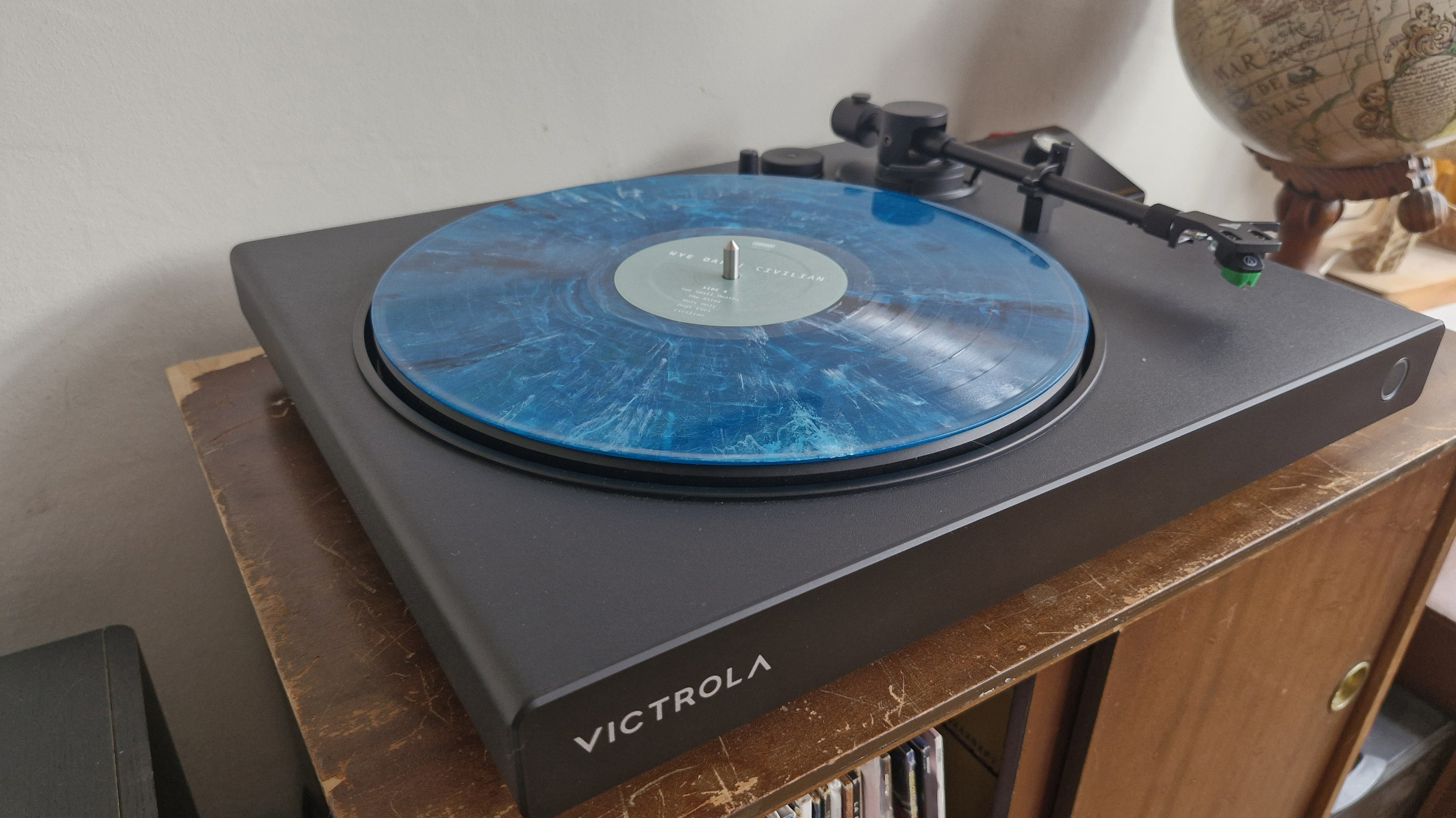 The Victrola hi-res onyx turntables on a wooden surface.