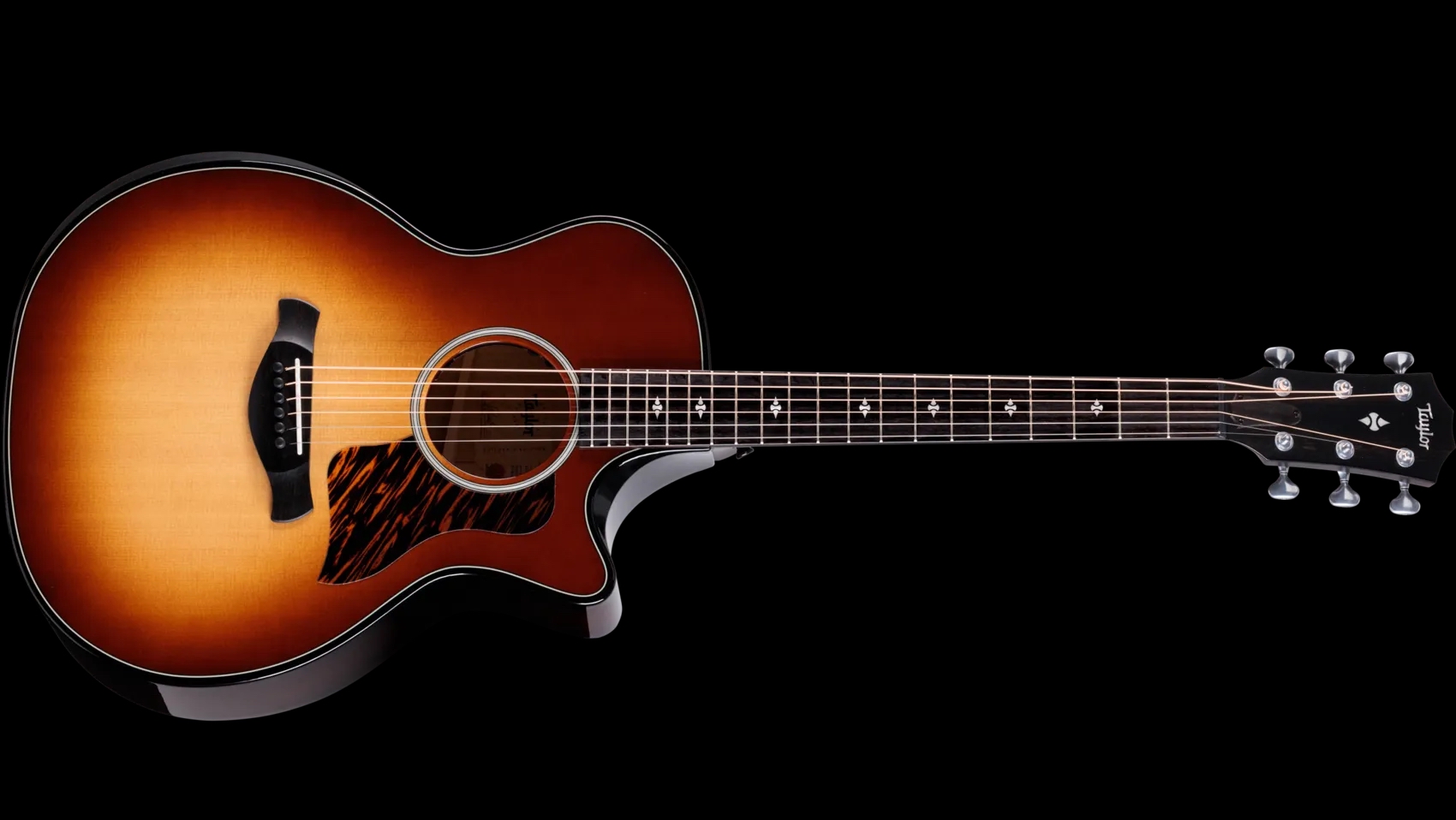 A photo showing a detail of the Taylor Next Generation 514ce Builder&amp;rsquo;s Edition in Kona Burst