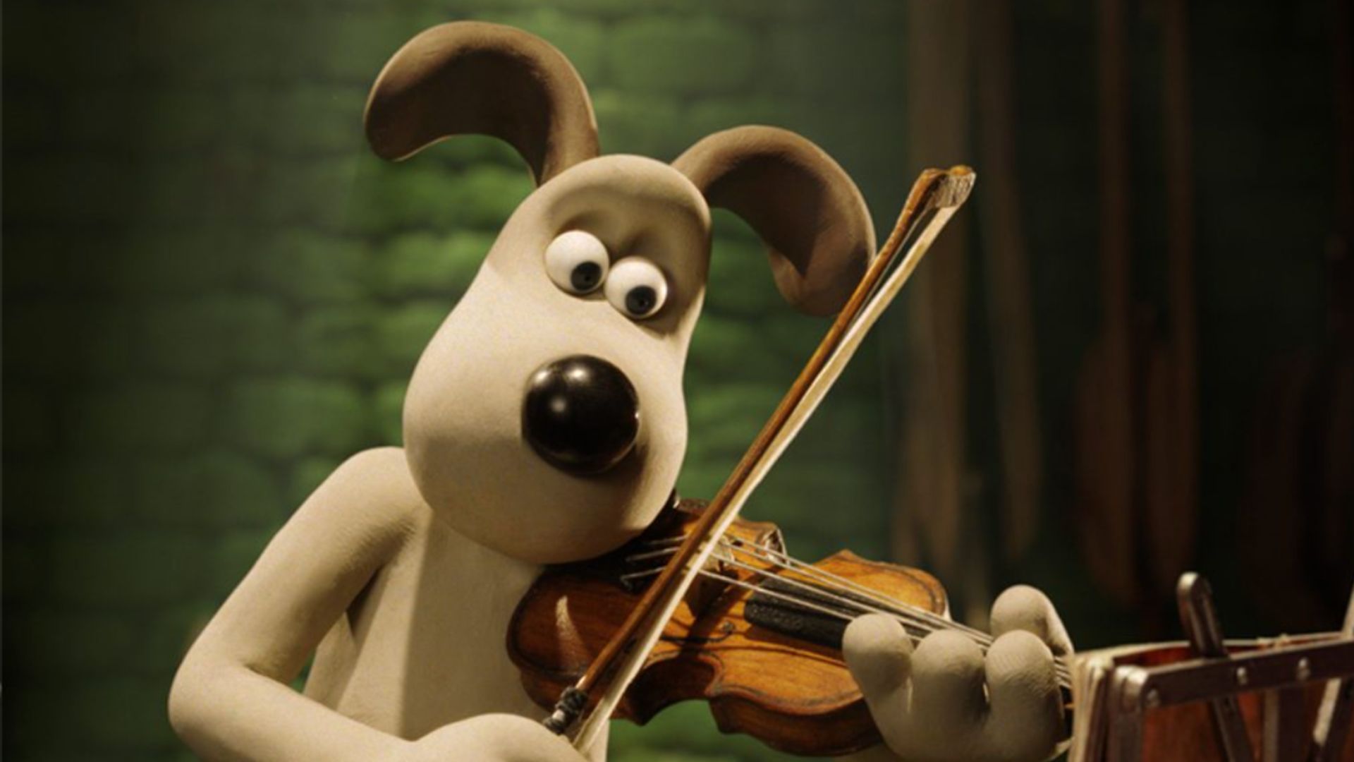an image of Gromit playing the violin from one of the Wallace &amp; Gromit films