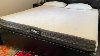 Puffy Cloud mattress review, featuring the mattress on a king-size bed frame in the tester's bedroom