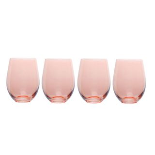 Four stemless colored wine glasses in blush pink