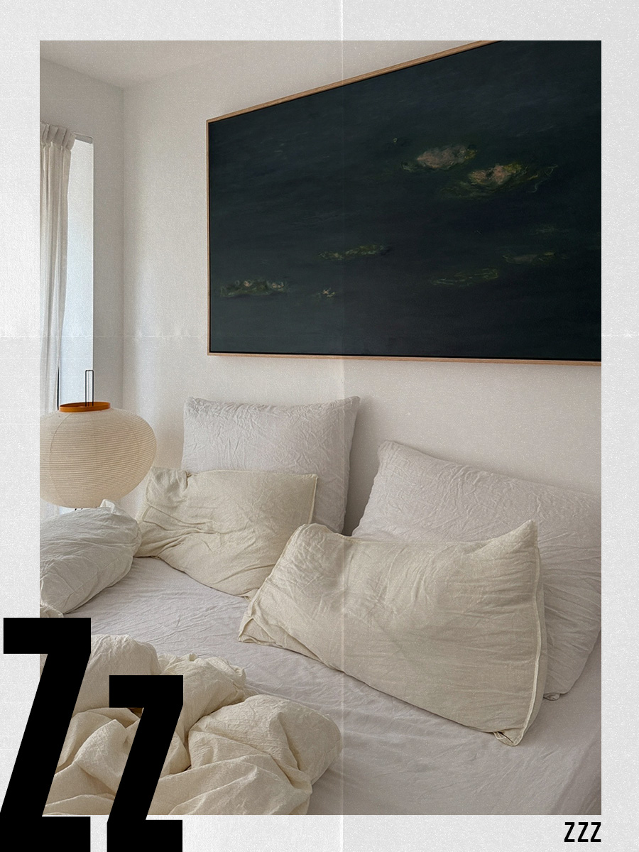 A picture of a bed with crumpled, white linen sheets