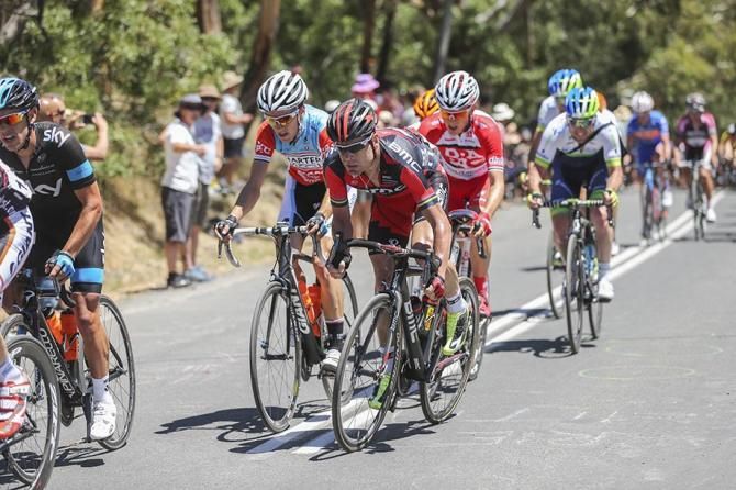 Cadel Evans reaches the top of the climb as the pace in chase of the break picks up a gear