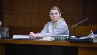 Abigail Breslin sitting in a courtroom in Accused