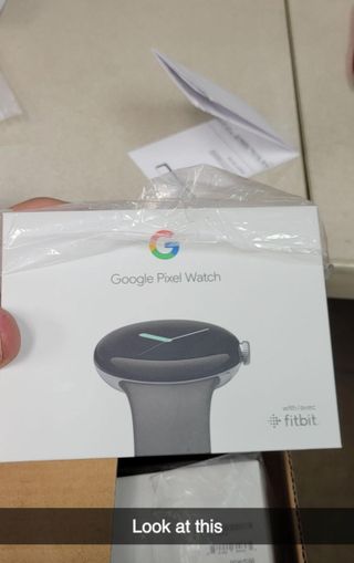 An image of the Google Pixel Watch retail packaging, with the caption "look at this"