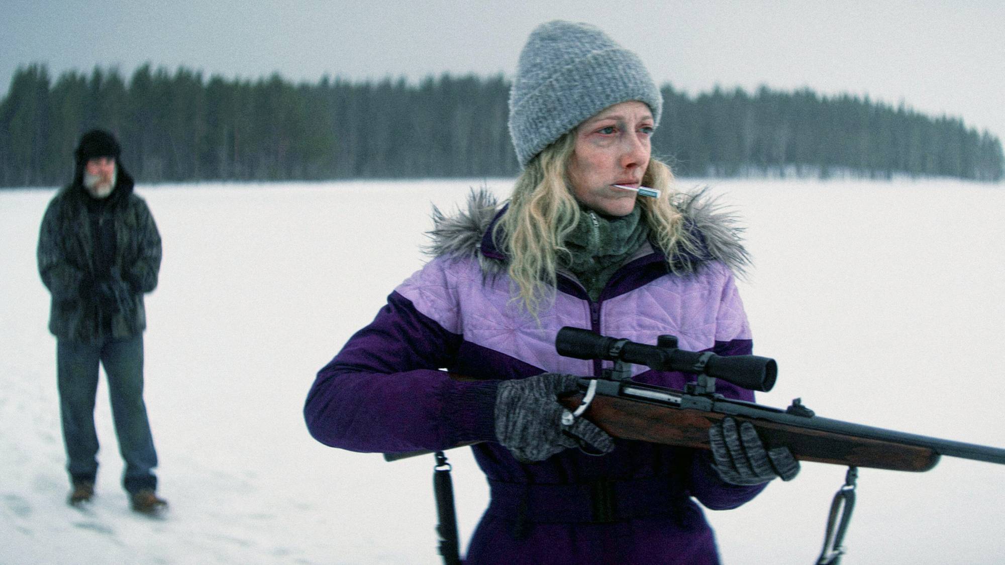 (L-R) Marc Menchaca as Camo Jacket and Judy Greer as Purple Lady in "Dead of Winter"