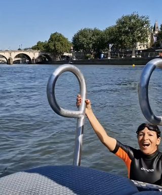 Mayor Hidalgo lowers herself into the Seine