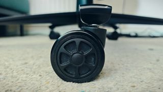 A black Boulies Ninja Pro chair in a small office