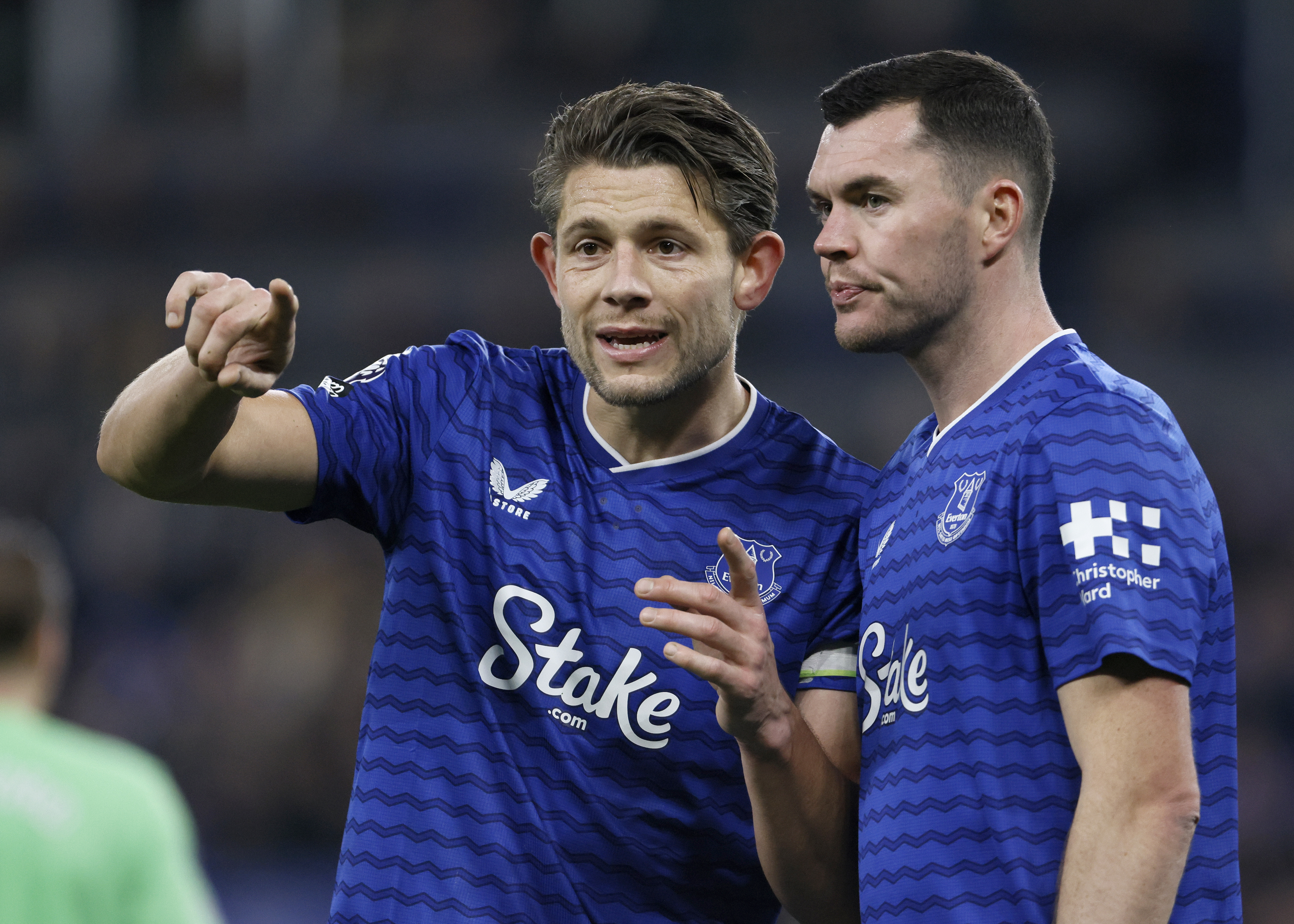 LIVERPOOL, ENGLAND - DECEMBER 20: James Tarkowski and Michael Keane of Everton discussing on the pitch during the Premier League match between Everton and Arsenal at Hill Dickinson on December 20, 2025 in Liverpool, England. (Photo by Richard Sellers/Sportsphoto/Allstar via Getty Images)
