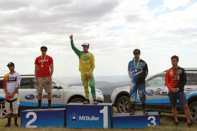 Troy Brosnan atop the elite men's downhill podium at round 2 of the Australian MTB national series in Mt. Buller.