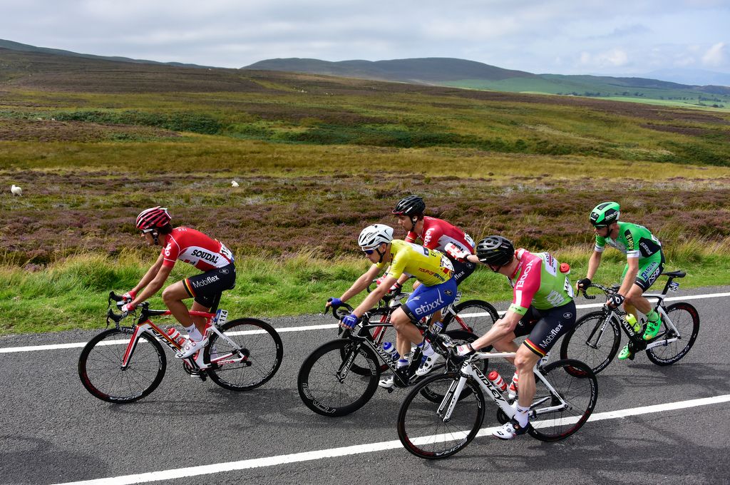 Andr&eacute; Greipel on domestique duty as he hands out bidons to his Lotto Soudal teammates