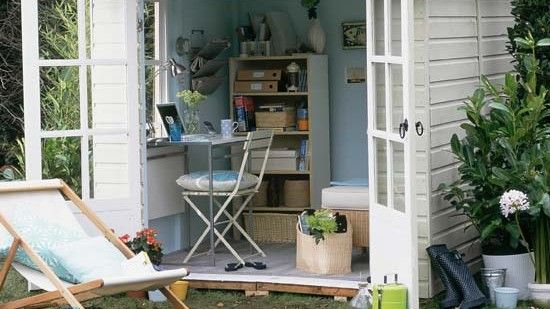 garden area with wooden shed 