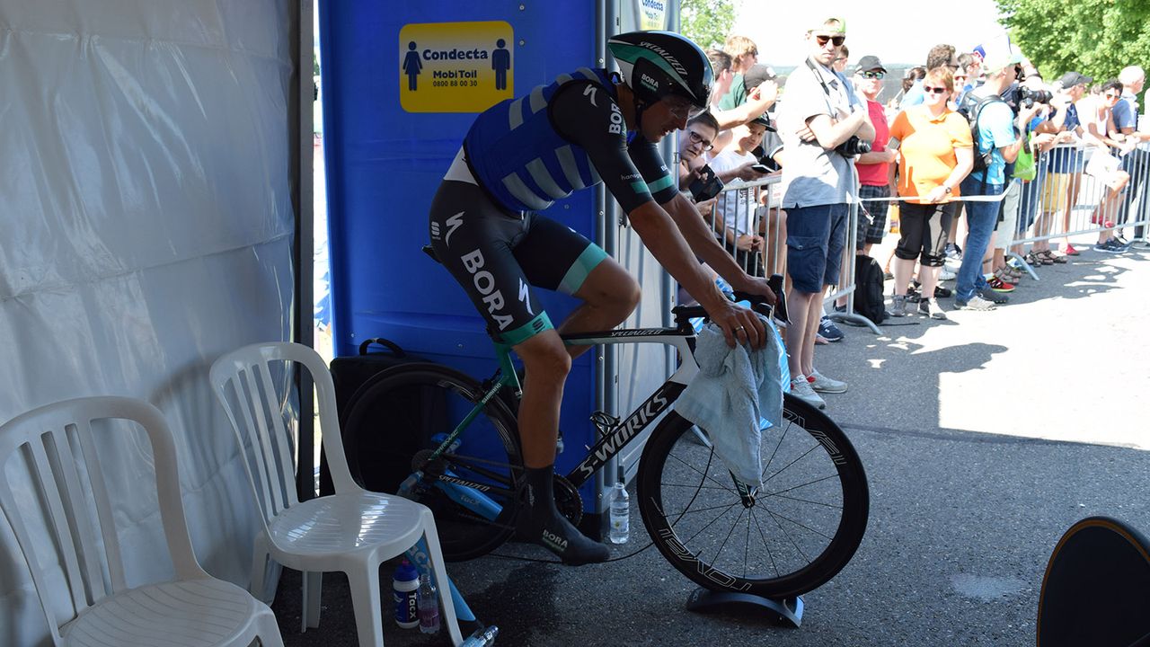 Bora-Hansgrohe's Marcus Burghardt was the only rider to use a turbo trainer at the start line to continue his warm-up