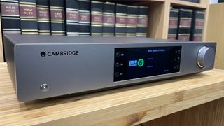 Cambridge Audio CXN100 music streamer shown at an angle with BBC Radio 6 Music playing on screen