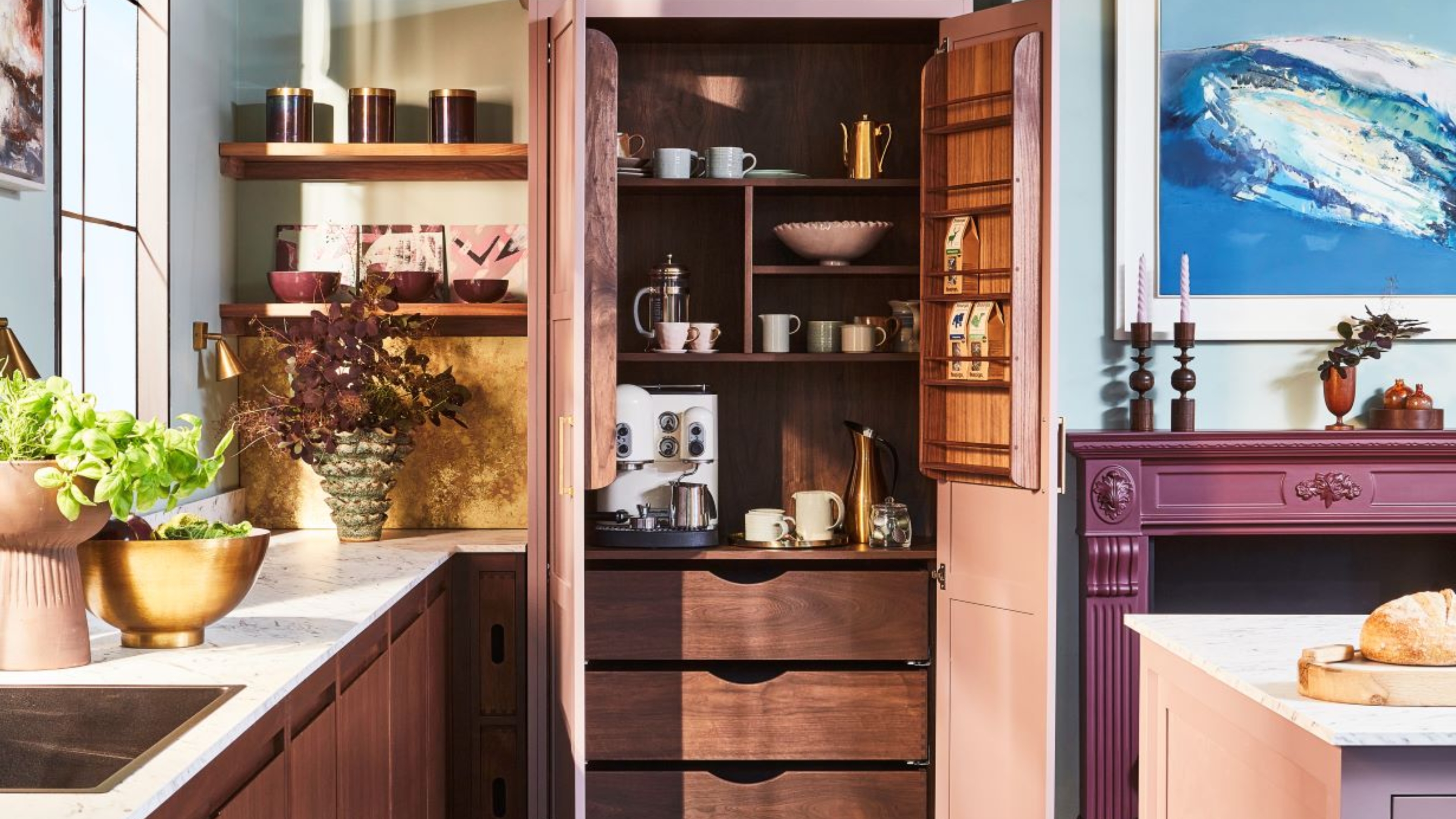 a coffee station in an eclectic modern colorful kitchen with wooden cabinets and a luxury coffee machine inside